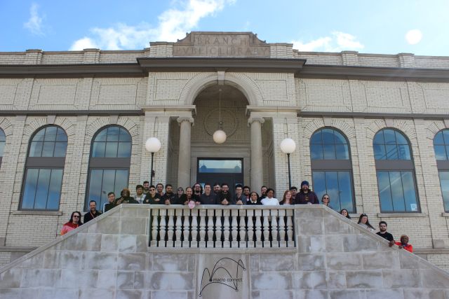 Full staff picture at the Macro Connect IT support building in Detroit, Michigan